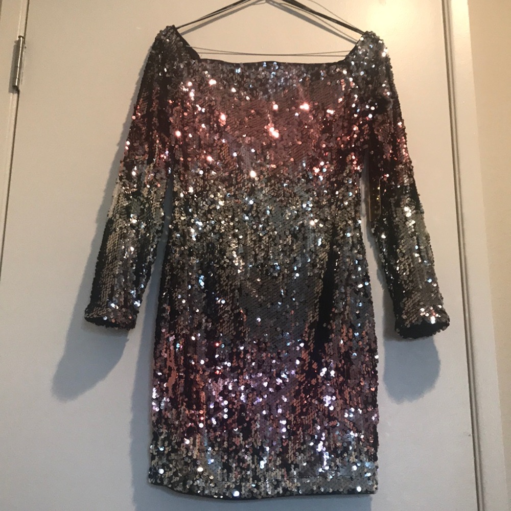 Off shoulder pink and silver sequined mini dress.